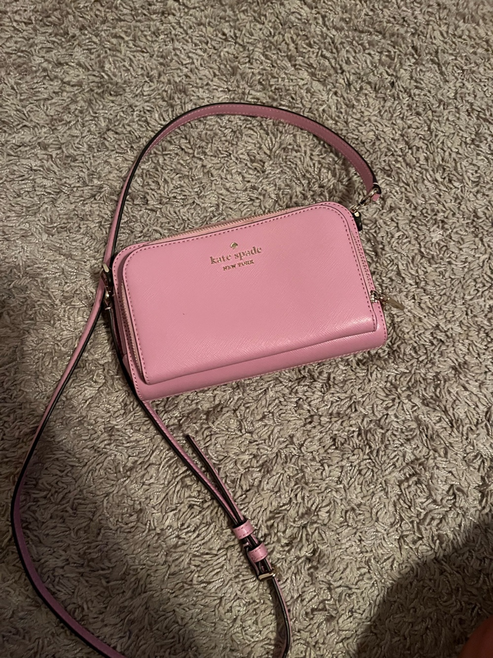 Kate Spade pink leather crossbody with gold logo